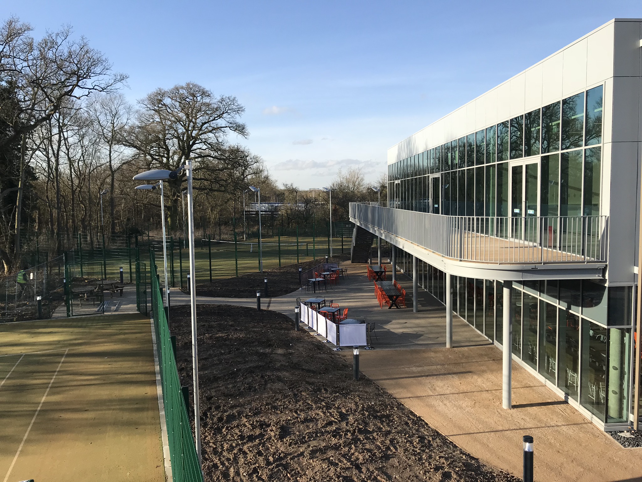 Girl sitting in her tent with a coffee